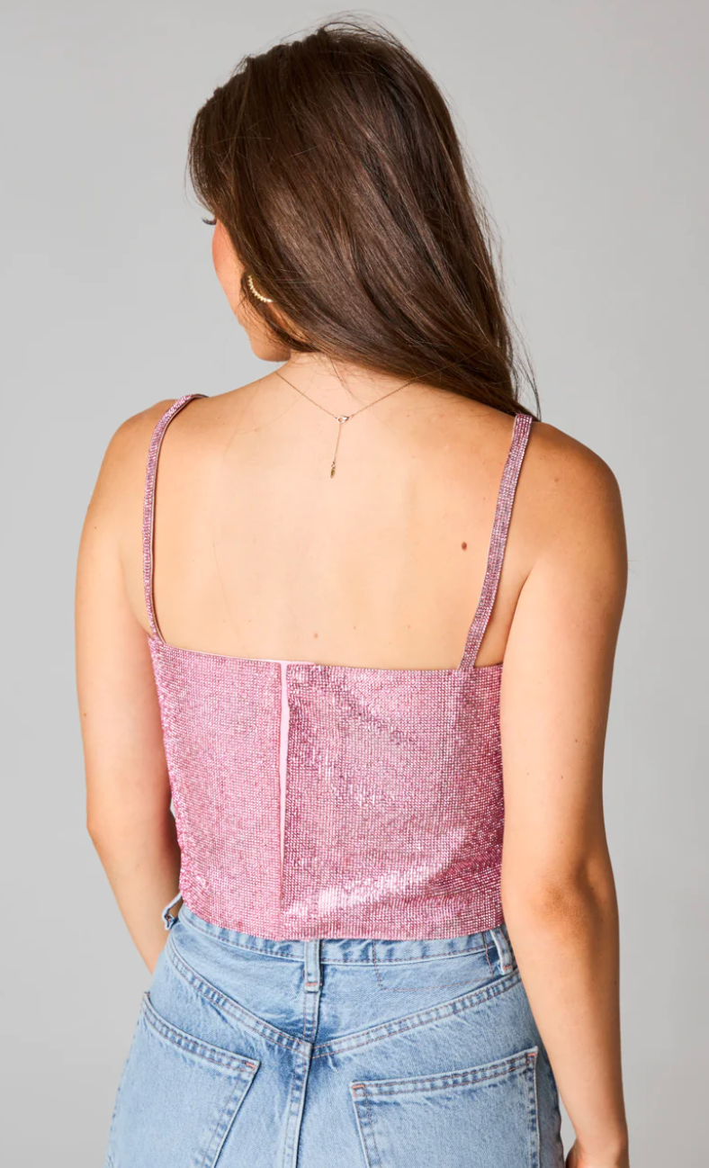 This pink rhinestone spaghetti strap top features a bra-stye closure in the back.