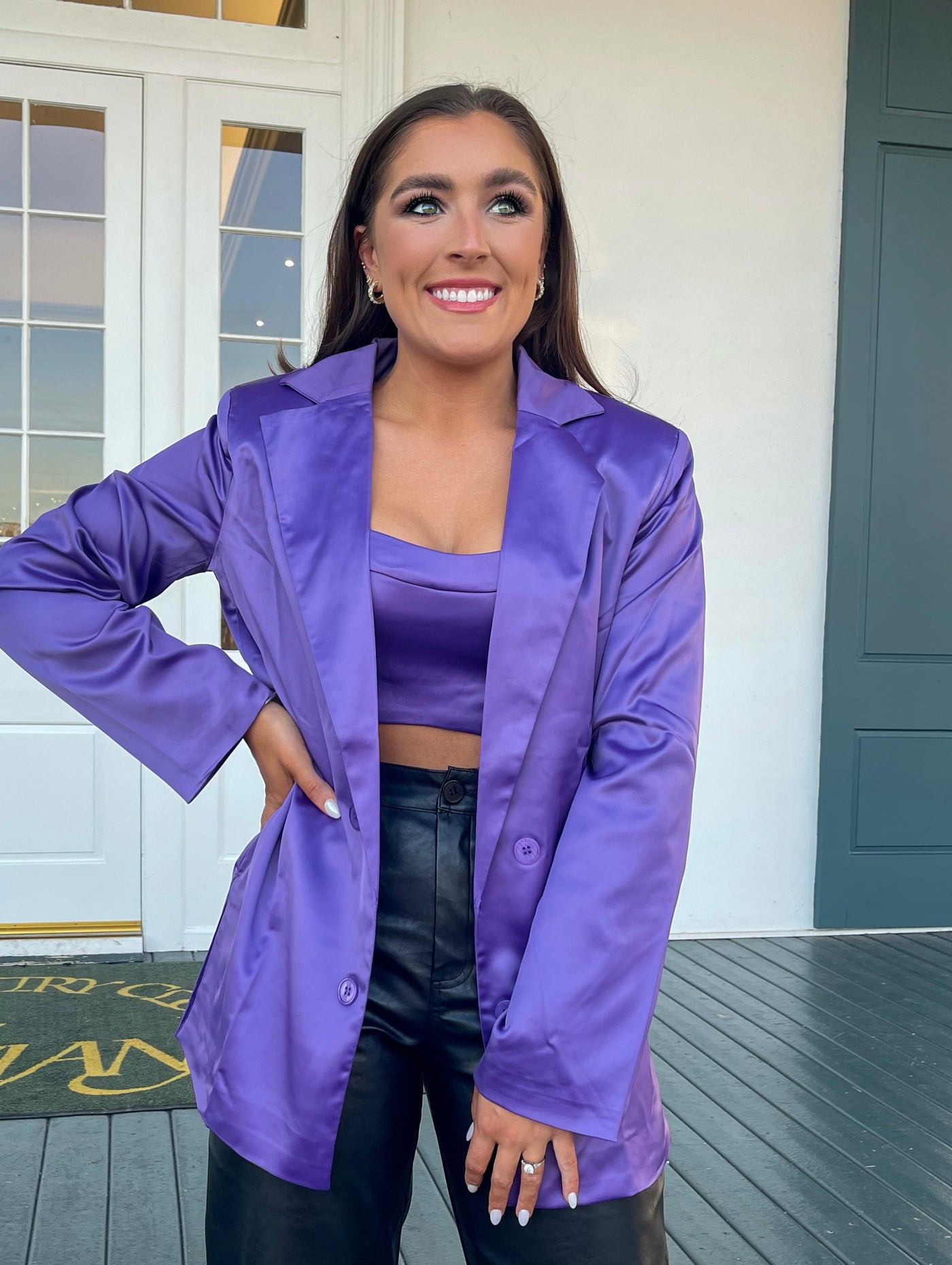 This purple crop top with matching blazer looks great with leather pants.
