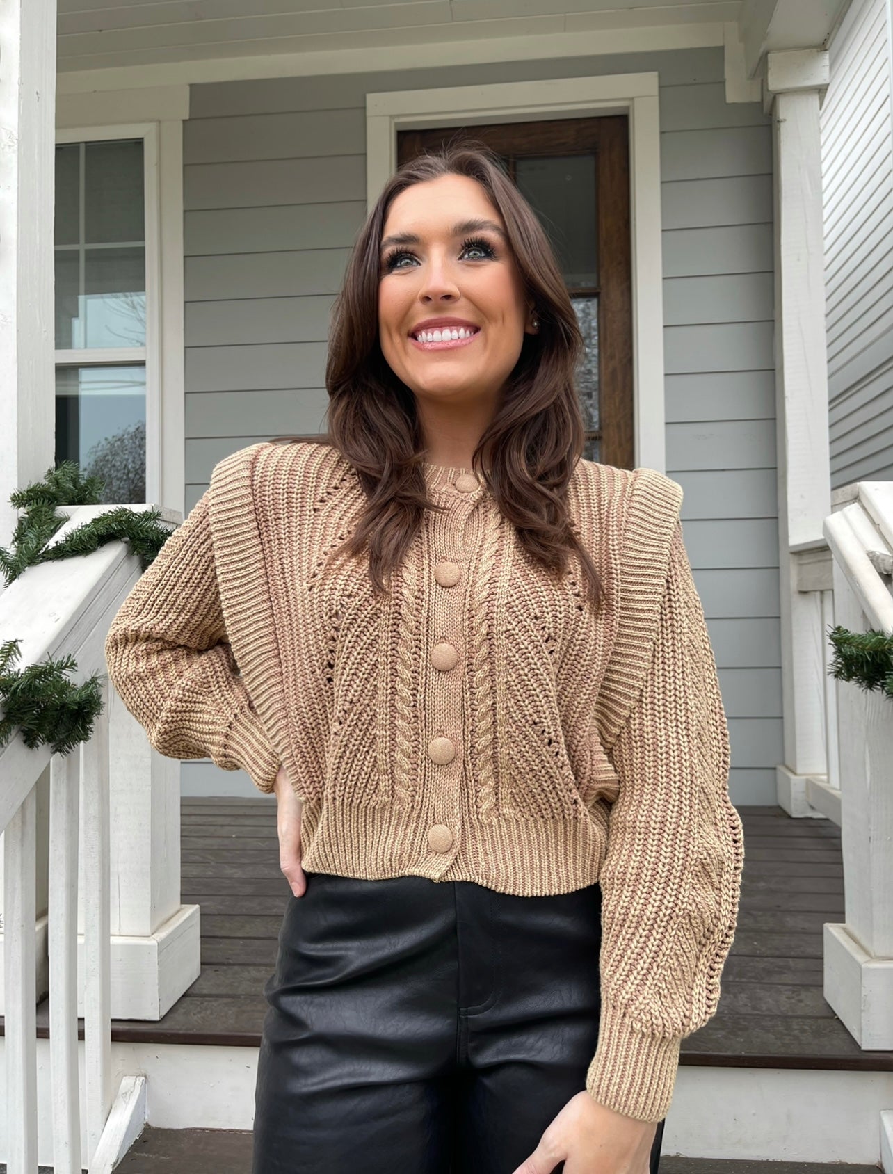 The Button Knit Cardigan from Shop Silvs features shoulder detailing and a button front closure; it's perfect for fall and pairs with a variety of colors. 