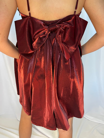 The Baby Doll Bow Dress from Shop Silvs features an accented bow tie on the back. 