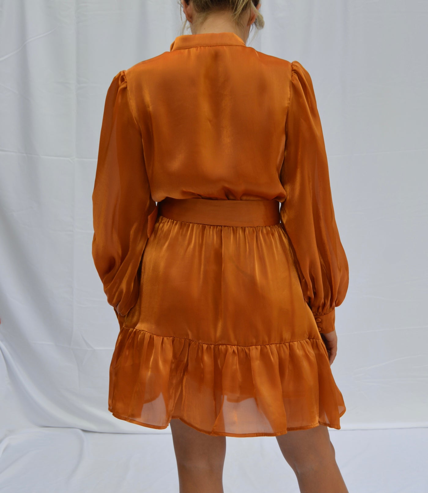 This burnt orange ruffle dress from Shop Silvs is perfect for Thanksgiving. 